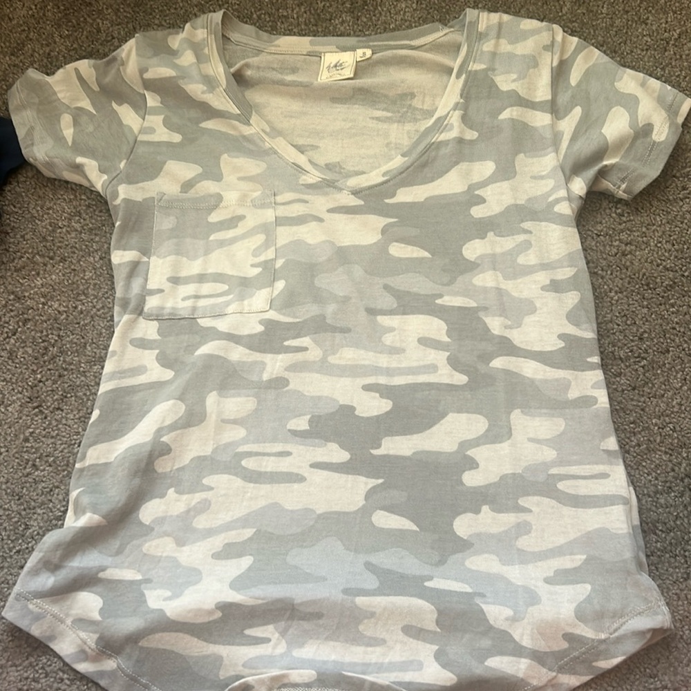 A a small camo shirt from buckle and white crow.